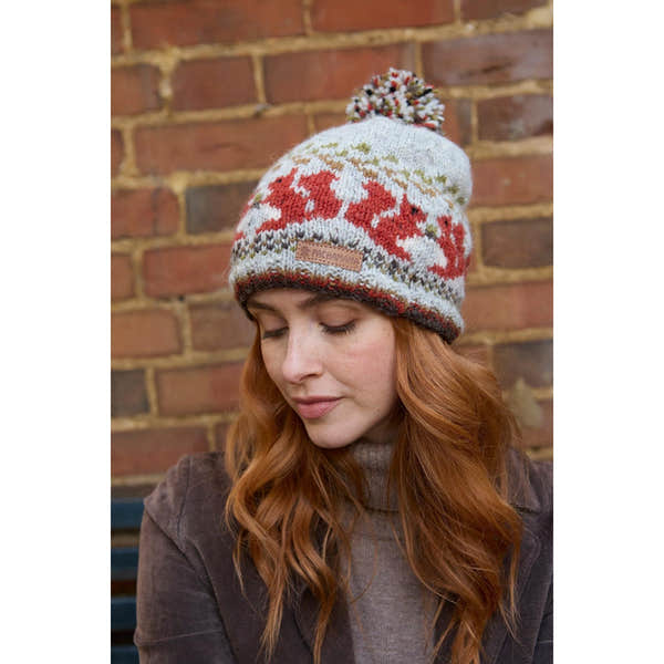 Pachamama Squirrel Bobble Beanie, with contrasting squirrel motifs; product view.