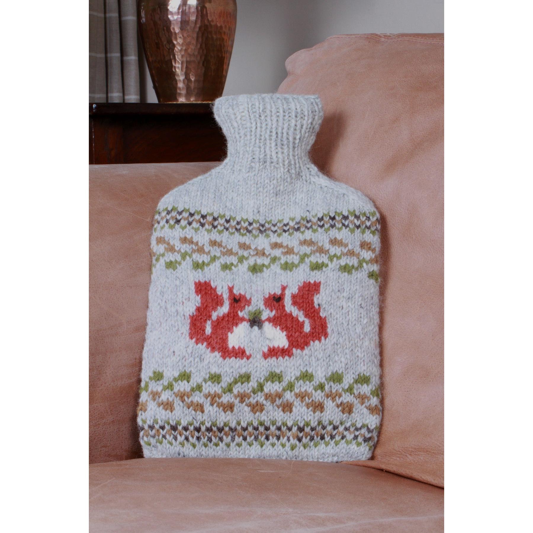 Pachamama Squirrel Hot Water Bottle, with contrasting squirrel motifs; product view.