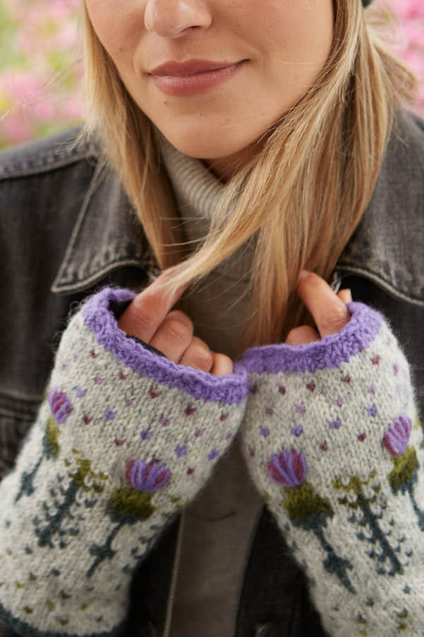 Pachamama Thistle Handwarmer, with embroidered purple thistles; product view.