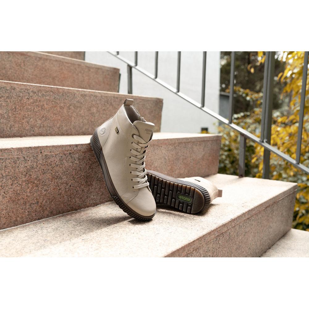 Remonte D0782-62 women's wide off white leather water resistant zip & lace ankle boots, lifestyle view 1 of 2.