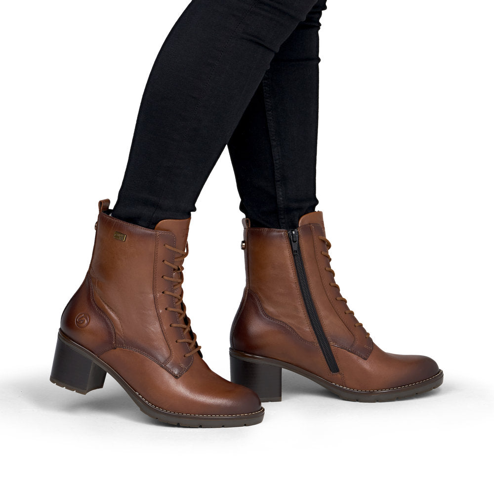 Remonte D2A80-24 women's brown leather water resistant zip & lace ankle boots, on-foot lifestyle view.