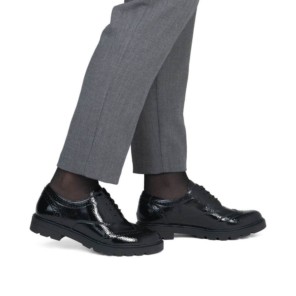 Remonte D2Q04-02 women's black patent brogue lace up shoes, on-foot lifestyle view.
