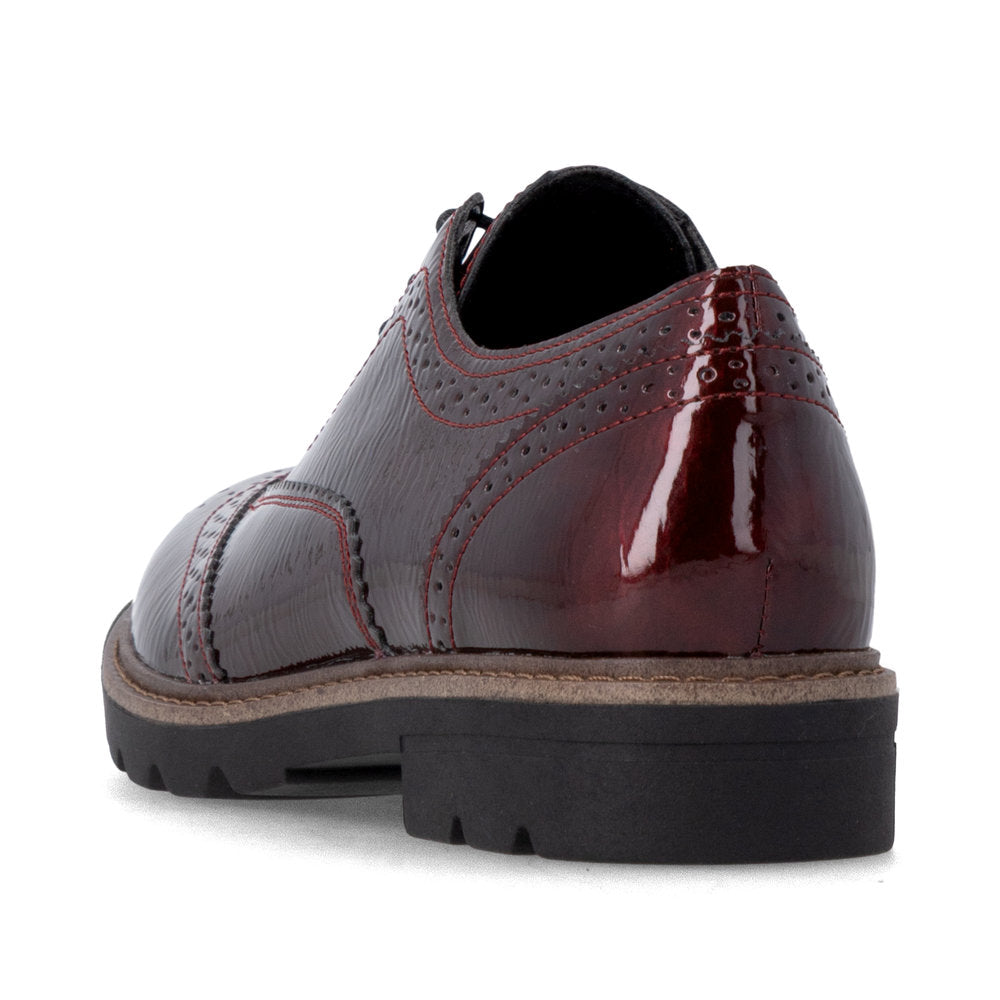 Remonte D2Q04-35 women's burgundy patent brogue lace up shoes, rear three-quarter view.