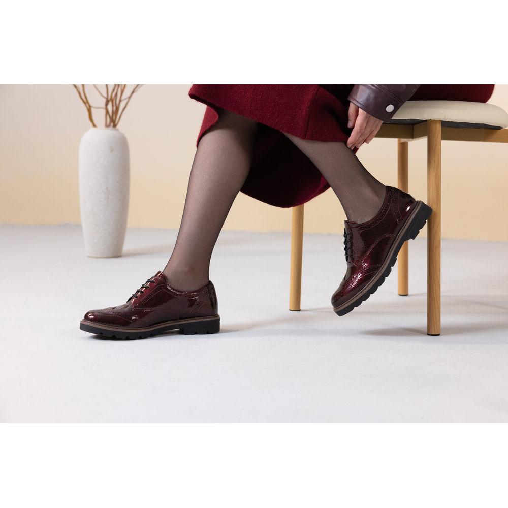 Remonte D2Q04-35 women's burgundy patent brogue lace up shoes, lifestyle view 1 of 4.