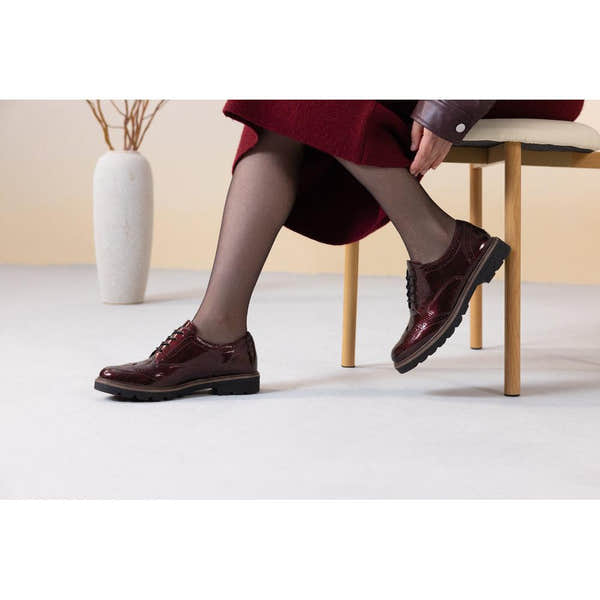 Remonte D2Q04-35 women's burgundy patent brogue lace up shoes, lifestyle view 1 of 4.