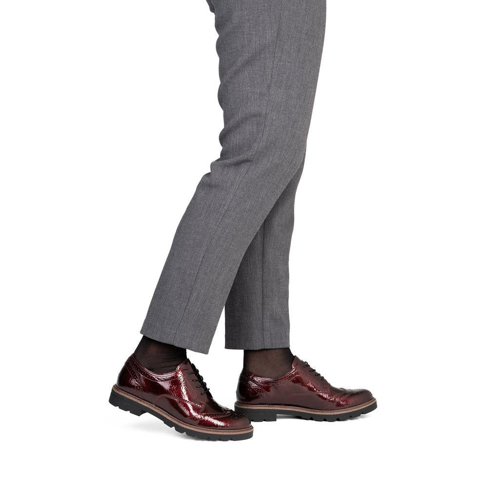 Remonte D2Q04-35 women's burgundy patent brogue lace up shoes, on-foot lifestyle view.