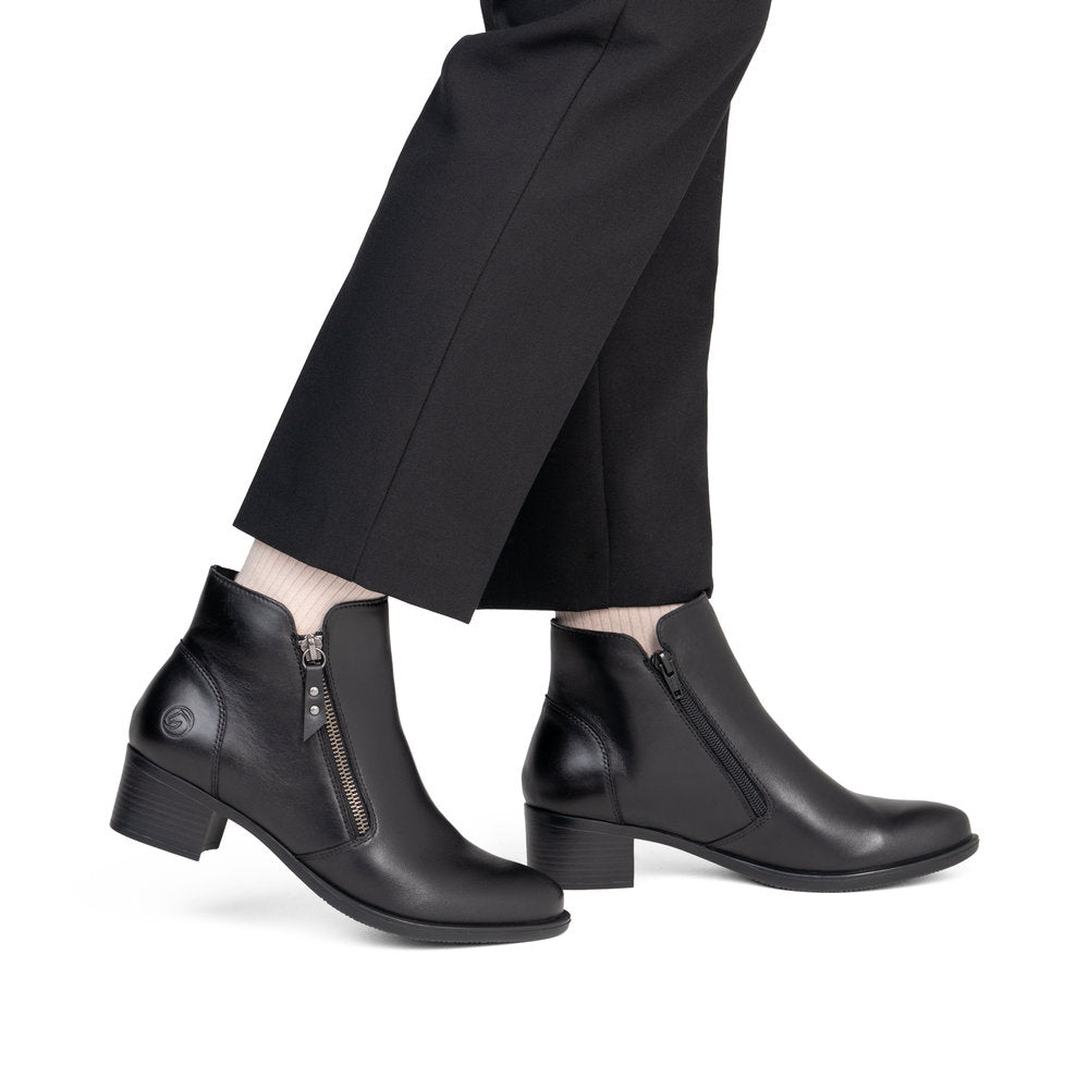 Remonte R5190-00 women's black leather side zip ankle boots, on-foot lifestyle view.