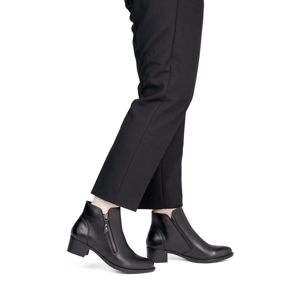 Remonte R5190-00 women's black leather side zip ankle boots, on-foot lifestyle view.