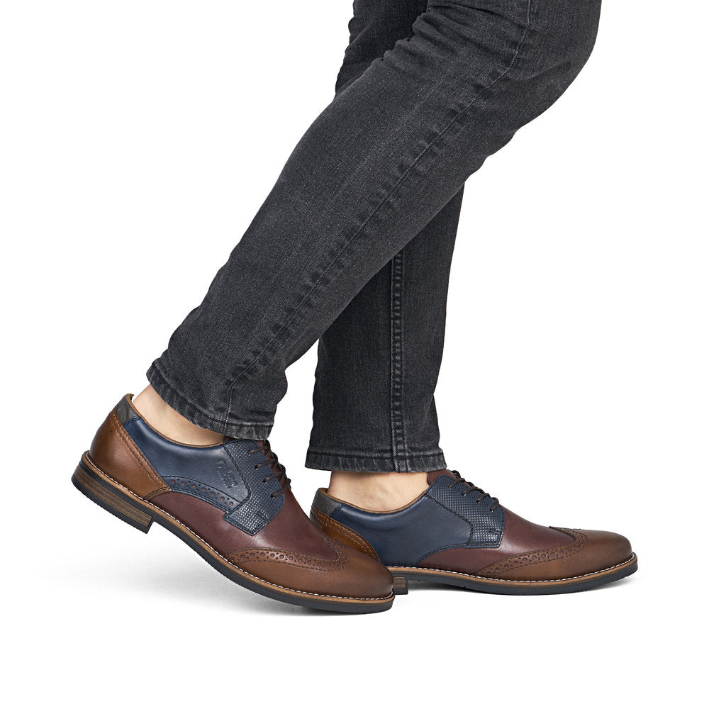Rieker 13528-90 men's wide brown multi leather lace up shoes, on-foot lifestyle view.