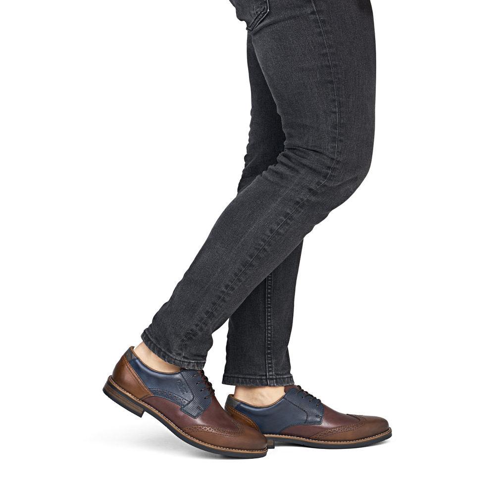 Rieker 13528-90 men's wide brown multi leather lace up shoes, on-foot lifestyle view.