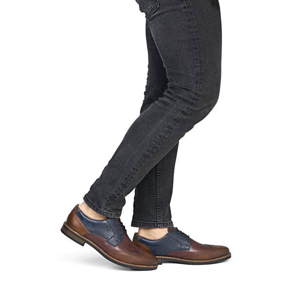 Rieker 13528-90 men's wide brown multi leather lace up shoes, on-foot lifestyle view.