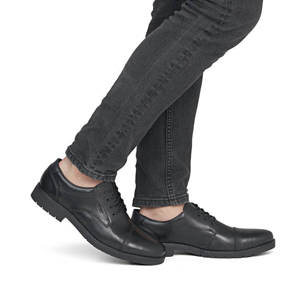 Rieker 13901-00 men's wide black leather lace up shoes, on-foot lifestyle view.