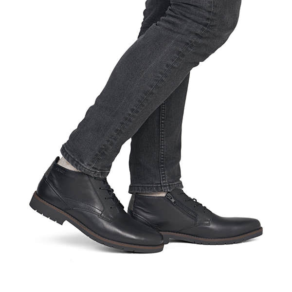 Rieker 13902-00 men's wide black leather zip & lace ankle boots, on-foot lifestyle view.