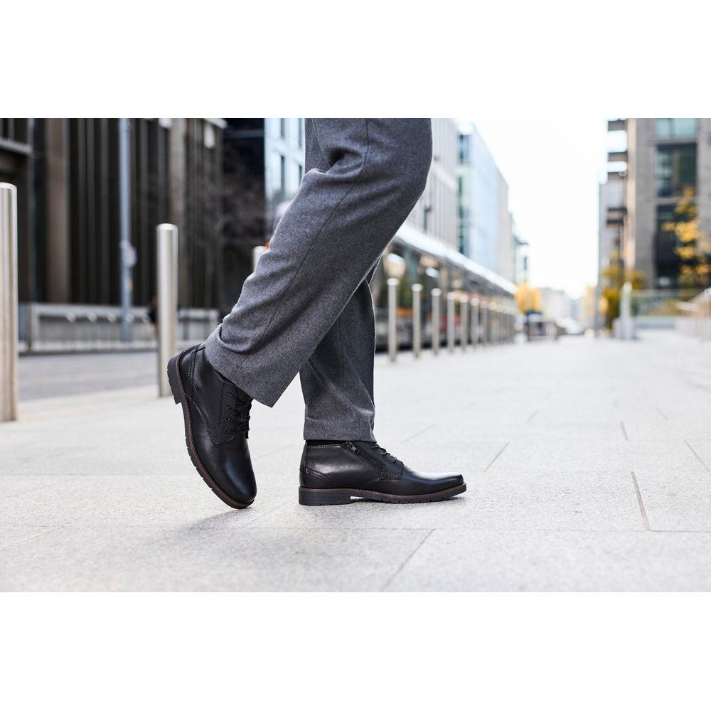 Rieker 13902-00 men's wide black leather zip & lace ankle boots, lifestyle view 4 of 4.