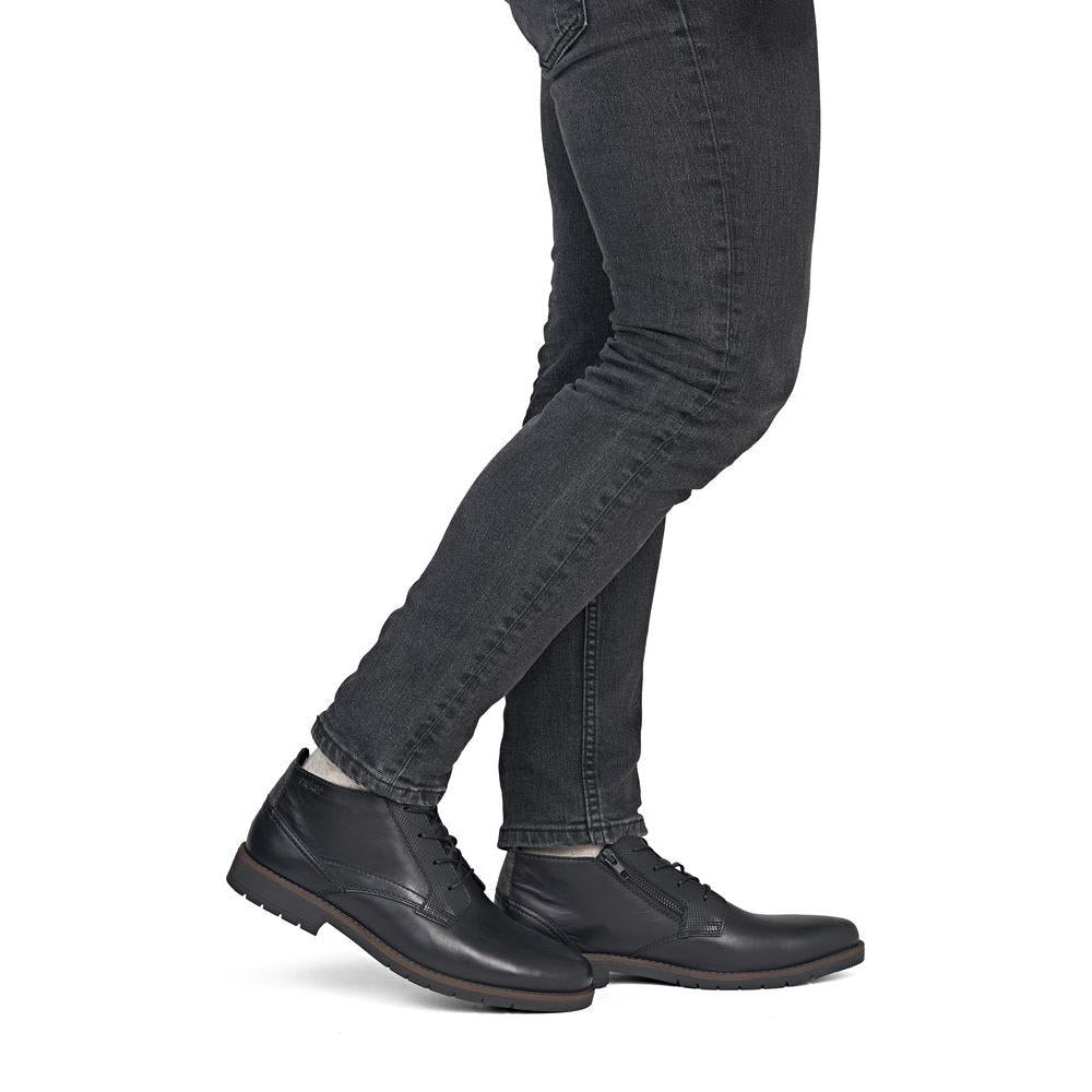 Rieker 13902-00 men's wide black leather zip & lace ankle boots, on-foot lifestyle view.