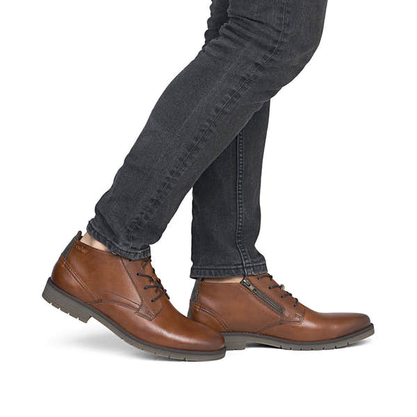 Rieker 13902-24 men's wide brown leather lace up ankle boots, on-foot lifestyle view.