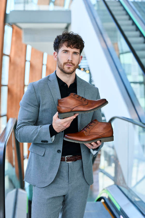 Rieker 13902-24 men's wide brown leather lace up ankle boots, lifestyle view 1 of 7.