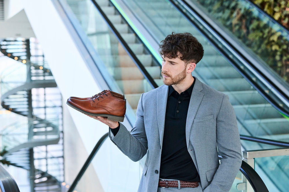 Rieker 13902-24 men's wide brown leather lace up ankle boots, lifestyle view 3 of 7.