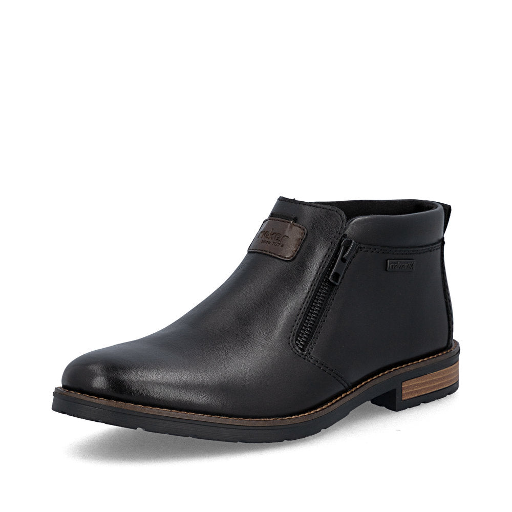 Rieker 14656-00 men's wide black leather water resistant side zip ankle boots, front three-quarter view.