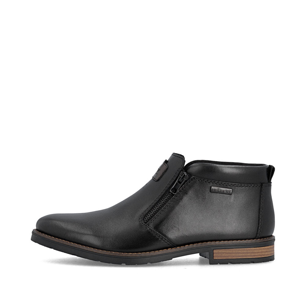 Rieker 14656-00 men's wide black leather water resistant side zip ankle boots, inner side view.