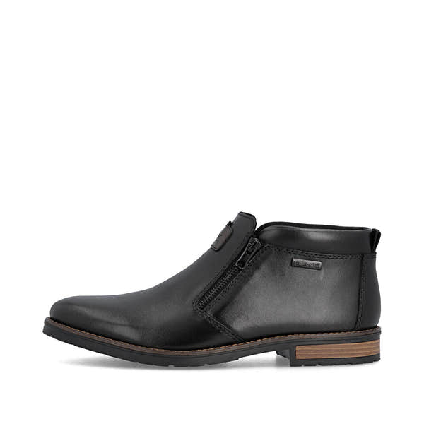 Rieker 14656-00 men's wide black leather water resistant side zip ankle boots, inner side view.