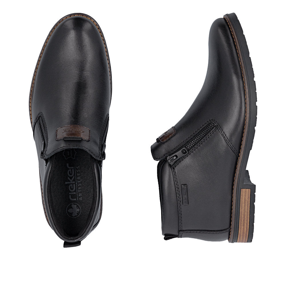 Rieker 14656-00 men's wide black leather water resistant side zip ankle boots, two-angle product view.