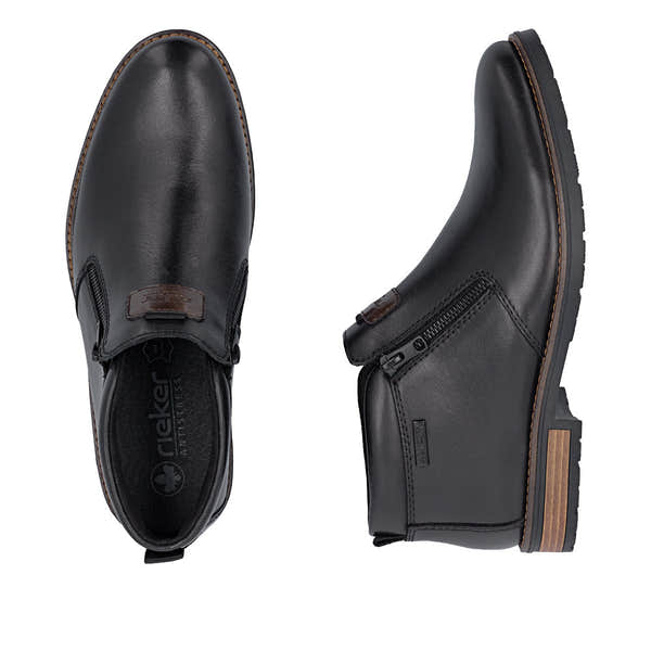 Rieker 14656-00 men's wide black leather water resistant side zip ankle boots, two-angle product view.