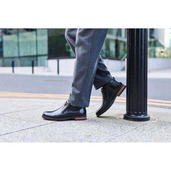Rieker 14656-00 men's wide black leather water resistant side zip ankle boots, lifestyle view 5 of 9.