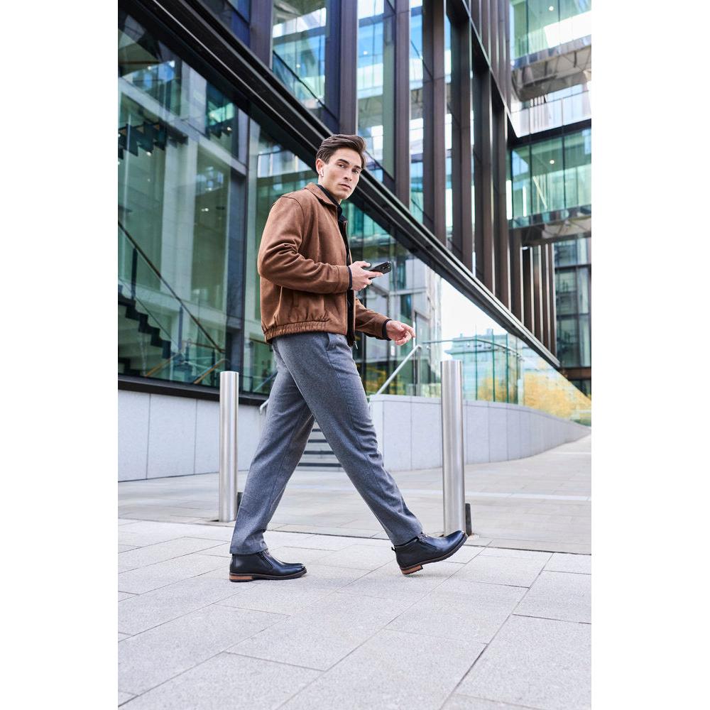 Rieker 14656-00 men's wide black leather water resistant side zip ankle boots, lifestyle view 6 of 9.