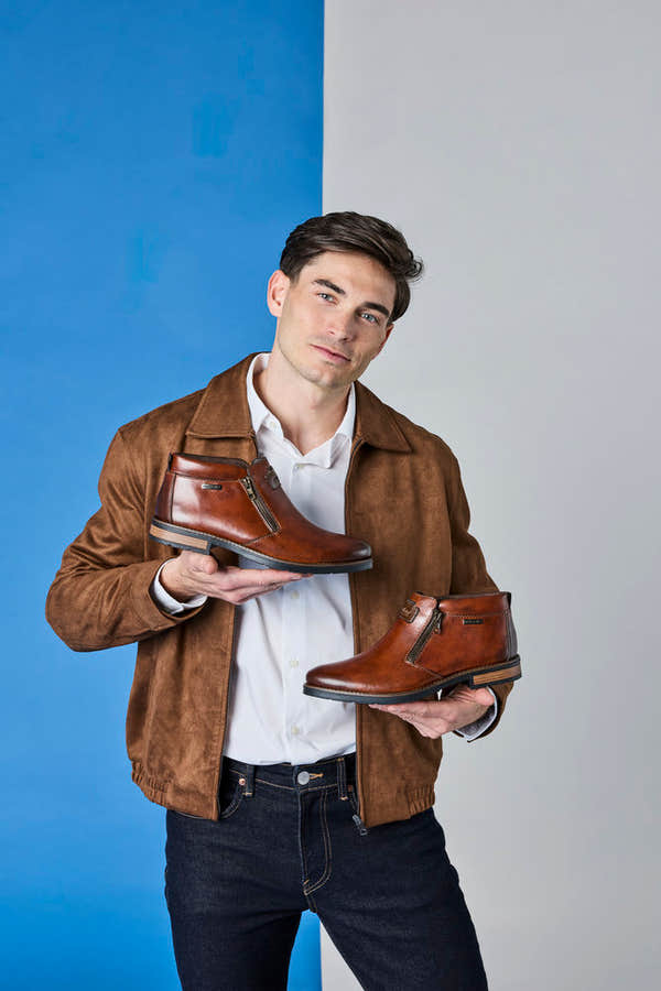 Rieker 14656-24 men's wide brown leather water resistant side zip ankle boots, lifestyle view 2 of 6.