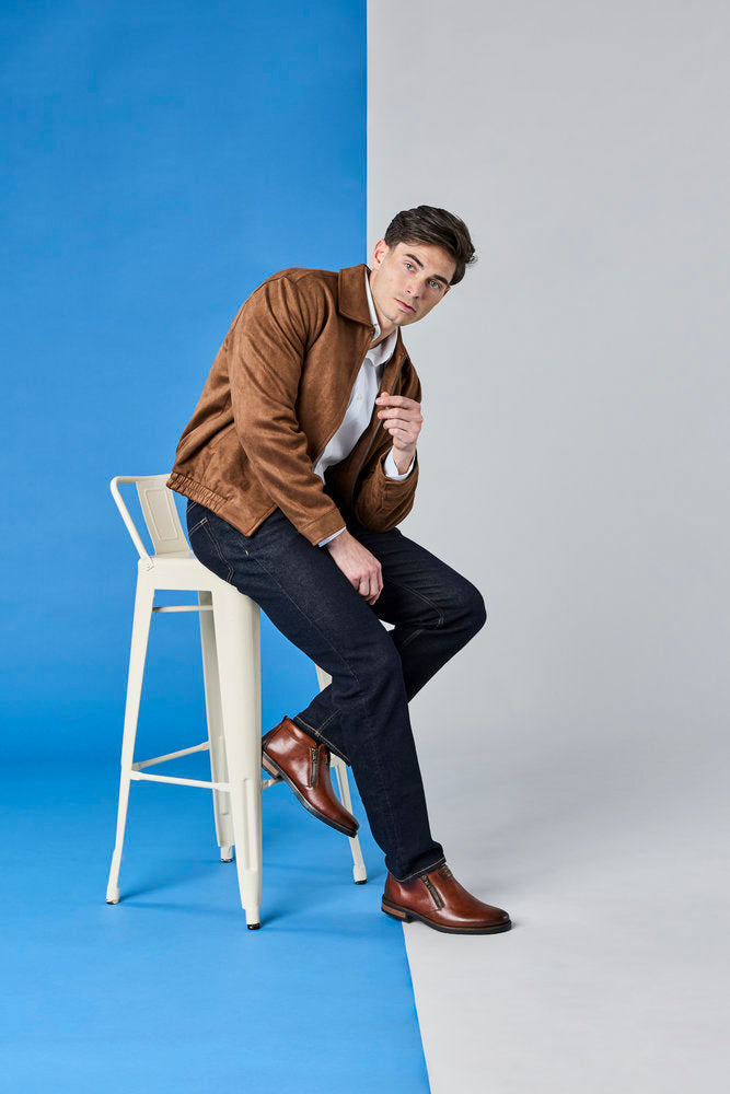 Rieker 14656-24 men's wide brown leather water resistant side zip ankle boots, lifestyle view 3 of 6.
