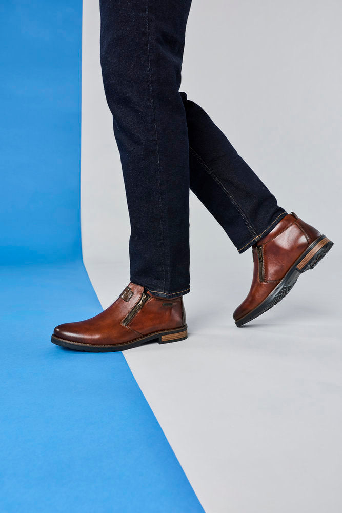 Rieker 14656-24 men's wide brown leather water resistant side zip ankle boots, lifestyle view 6 of 6.