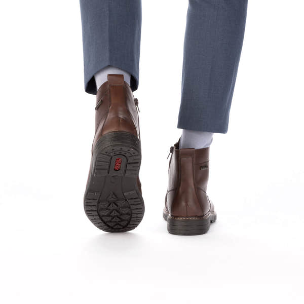Rieker 33143-25 men's brown leather water resistant zip & lace ankle boots, lifestyle view 3 of 4.