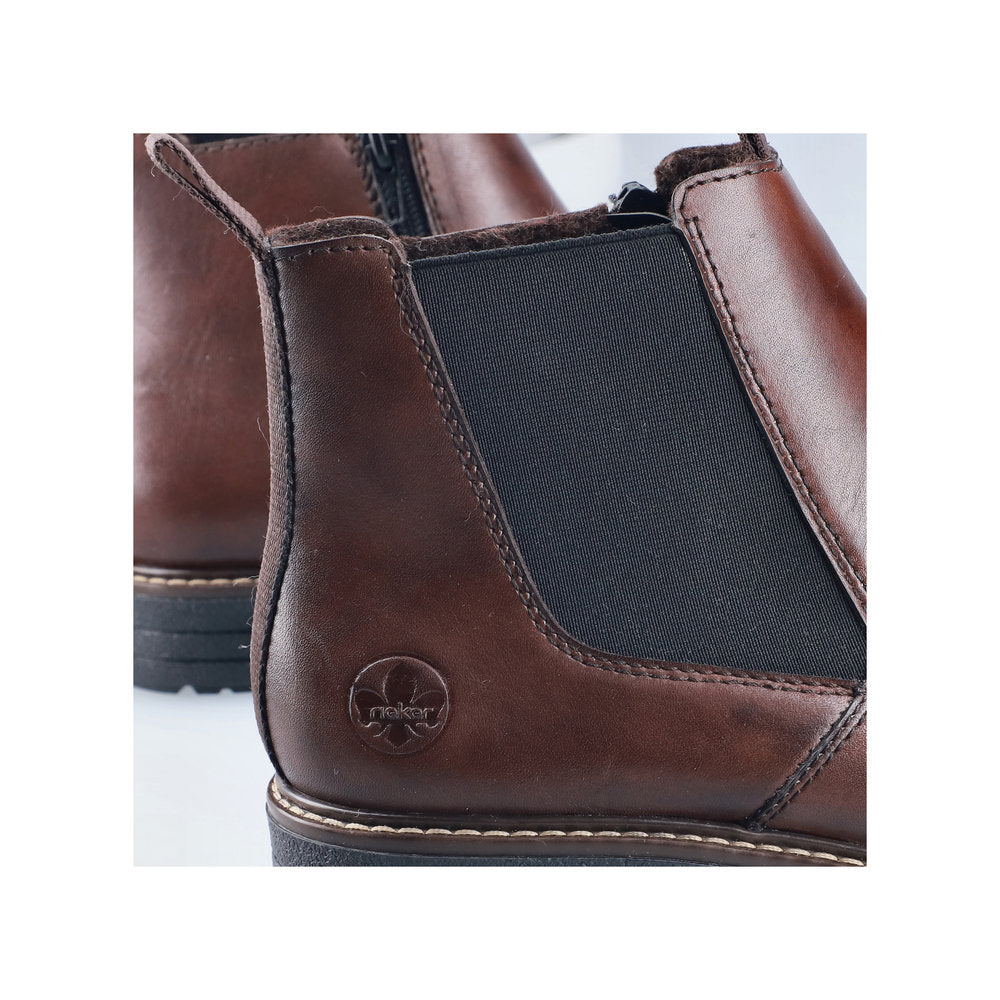 Rieker 33180-26 men's brown leather side zip ankle boots, lifestyle view.