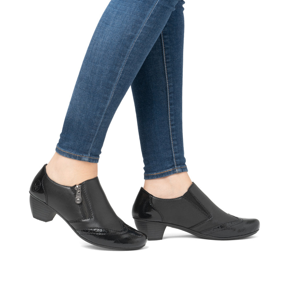 Rieker 41757-00 women's black leather side zip shoe boots, on-foot lifestyle view.