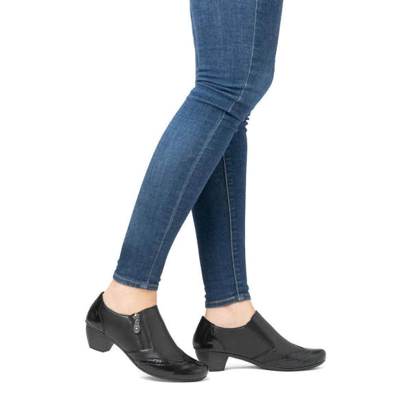 Rieker 41757-00 women's black leather side zip shoe boots, on-foot lifestyle view.