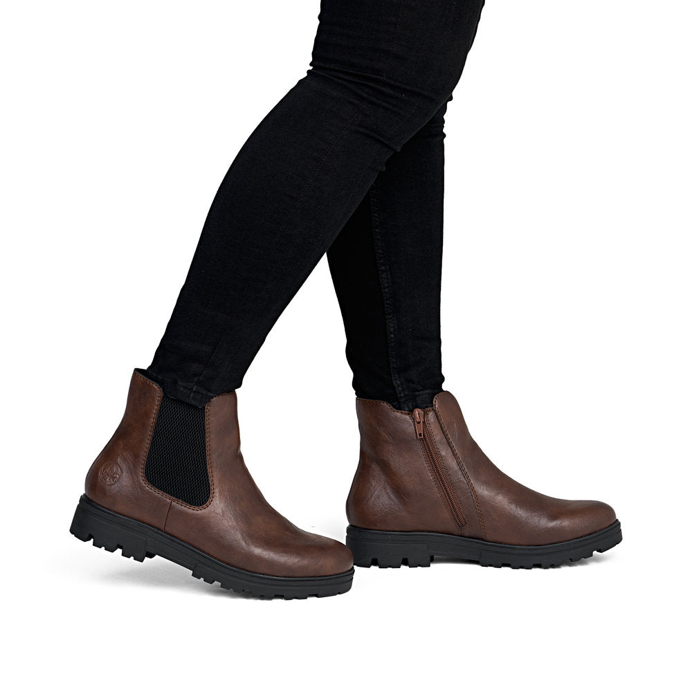 Rieker 43072-22 women's wide brown side zip ankle boots, on-foot lifestyle view.