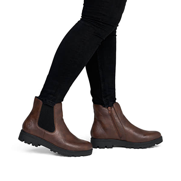 Rieker 43072-22 women's wide brown side zip ankle boots, on-foot lifestyle view.