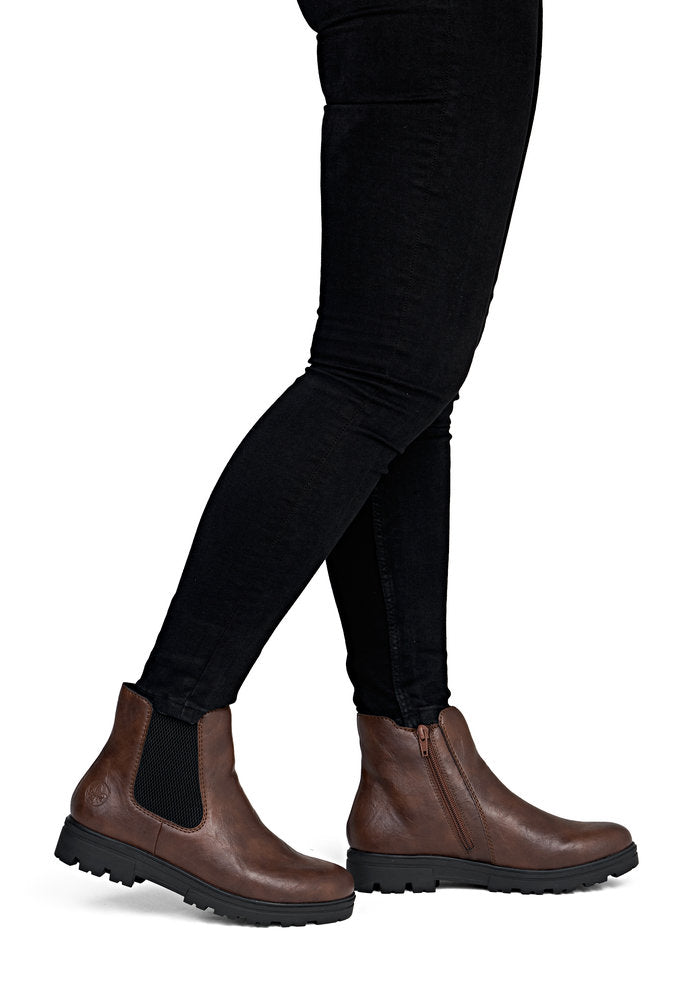 Rieker 43072-22 women's wide brown side zip ankle boots, on-foot lifestyle view.