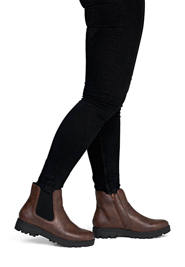 Rieker 43072-22 women's wide brown side zip ankle boots, on-foot lifestyle view.