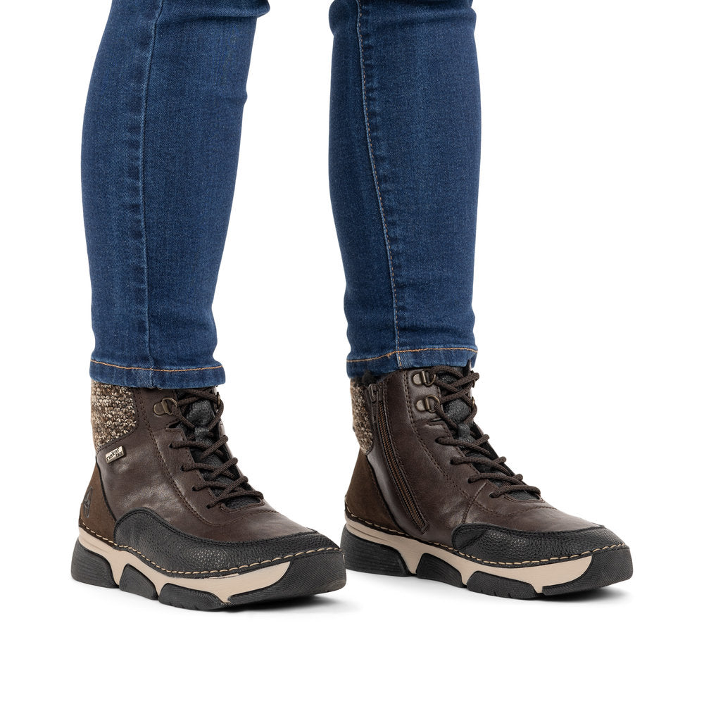 Rieker 45956-25 women's multi water resistant zip & lace ankle boots, on-foot lifestyle view.
