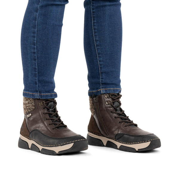 Rieker 45956-25 women's multi water resistant zip & lace ankle boots, on-foot lifestyle view.