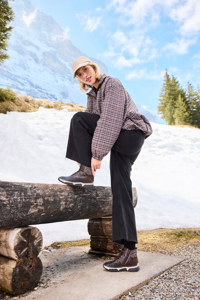 Rieker 45956-25 women's multi water resistant zip & lace ankle boots, lifestyle view 9 of 11.