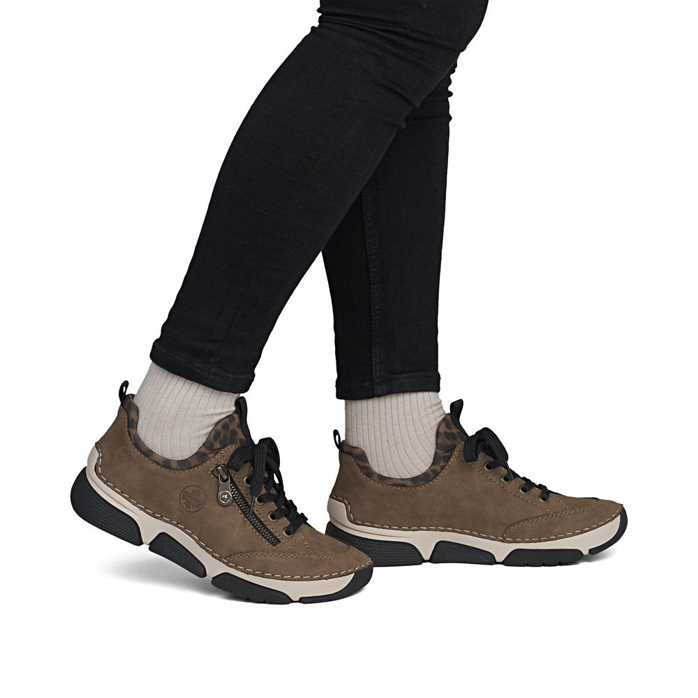 Rieker 45973-24 women's brown elasticated shoes, on-foot lifestyle view.