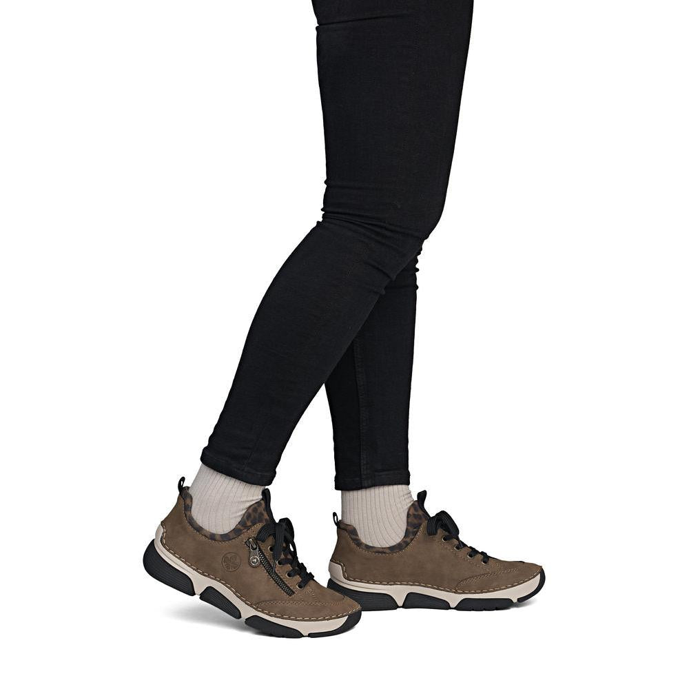 Rieker 45973-24 women's brown elasticated shoes, on-foot lifestyle view.