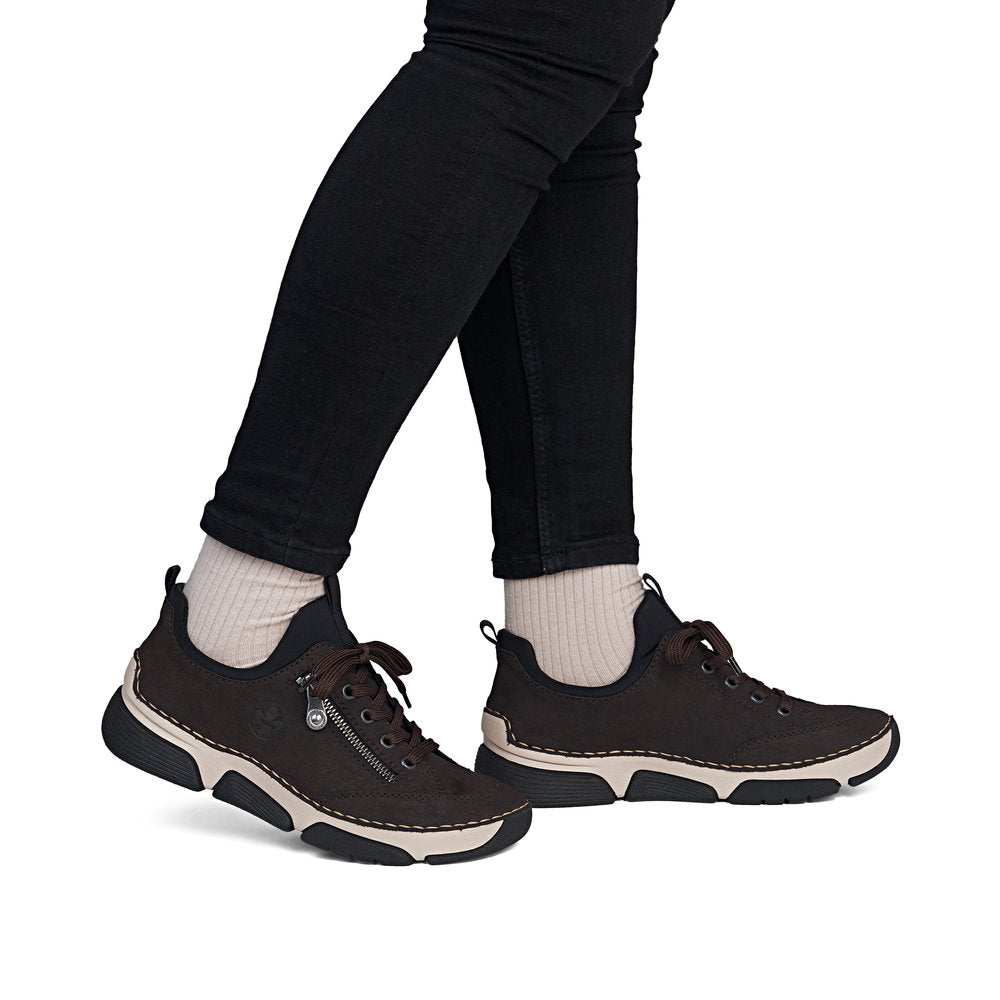 Rieker 45973-25 women's black elasticated shoes, on-foot lifestyle view.