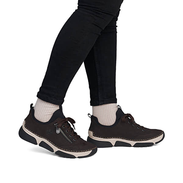 Rieker 45973-25 women's black elasticated shoes, on-foot lifestyle view.