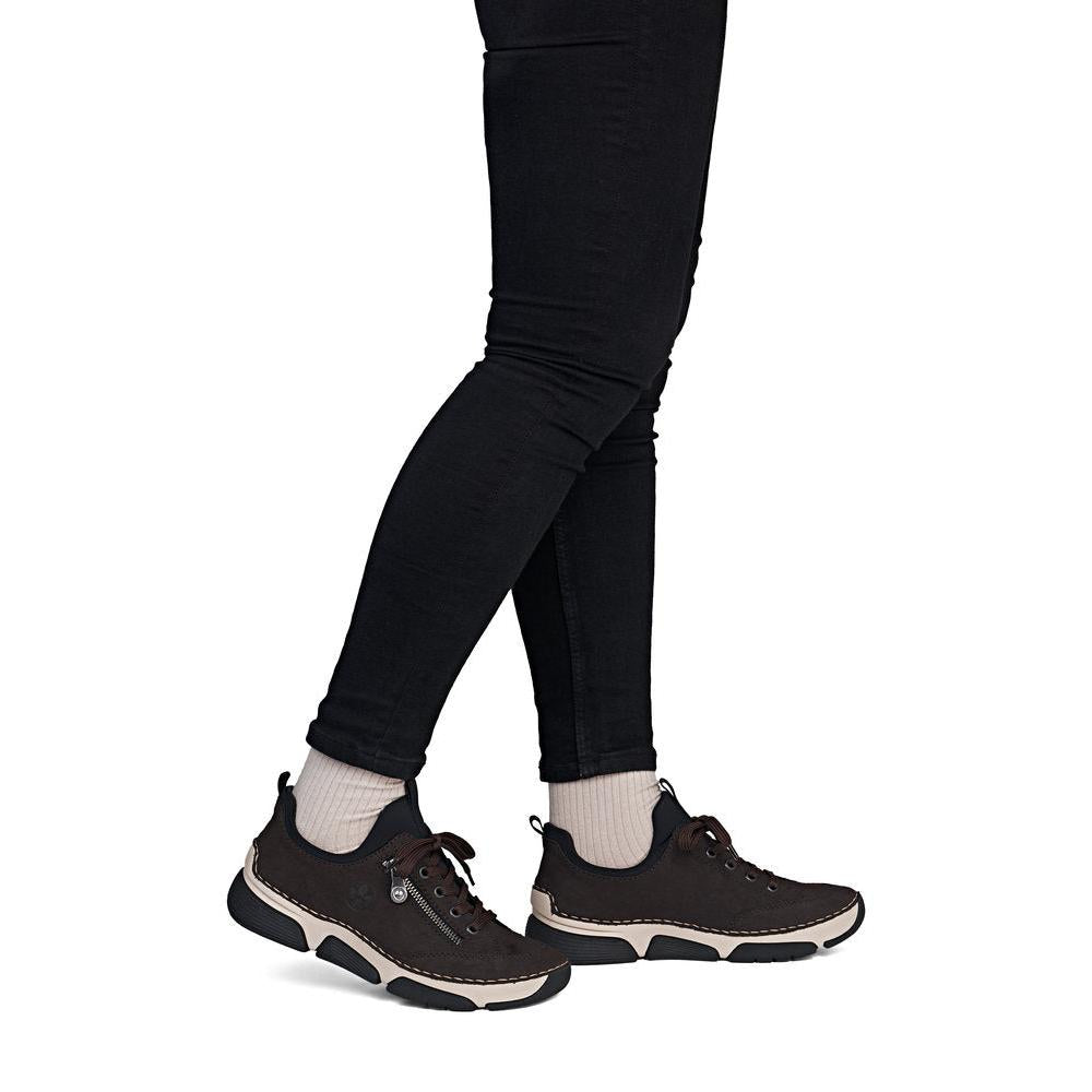 Rieker 45973-25 women's black elasticated shoes, on-foot lifestyle view.