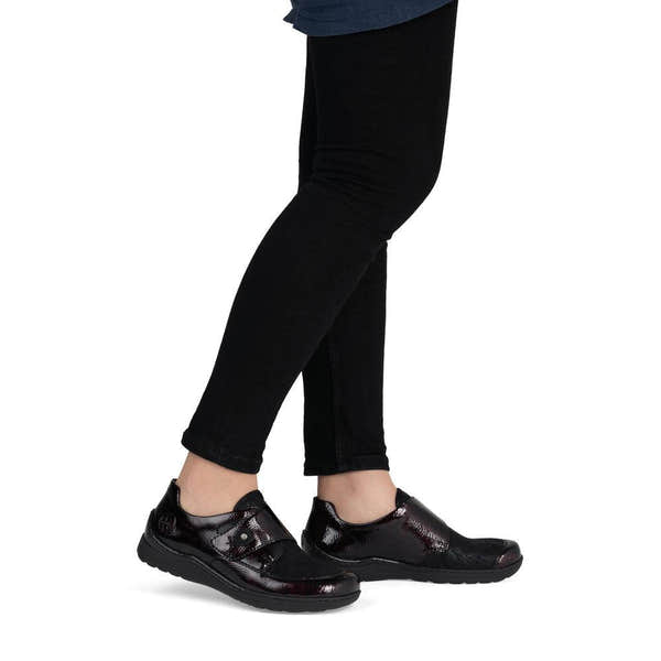 Rieker 48951-35 women's red touch fastening shoes, on-foot lifestyle view.