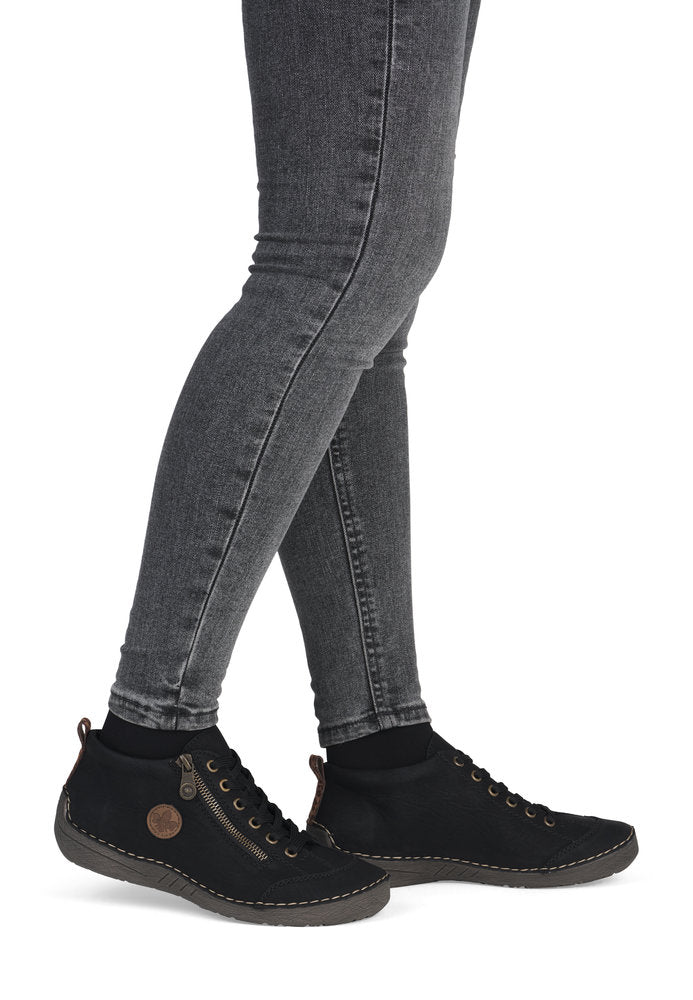 Rieker 52514-00 women's black zip & lace shoe boots, on-foot lifestyle view.